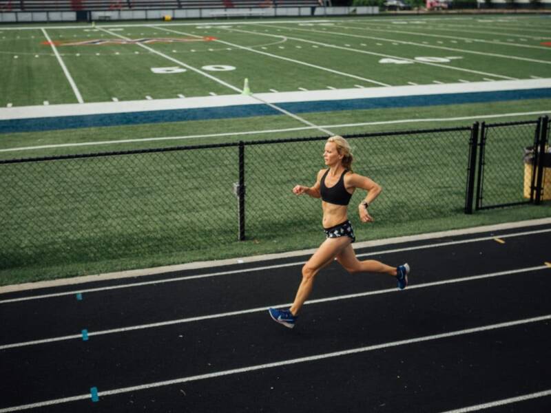 mother runner running on track.