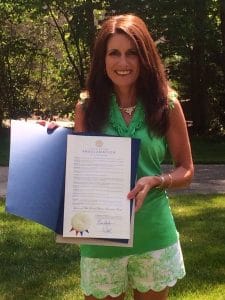 Doctors told Connie there was nothing wrong with her. A friend helped solve the mystery. Connie is shown here with the official Tennessee proclamation of Lyme Disease Awareness Month (May).