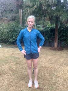 Whitney Heins outside in blue Houdini jacket from Patagonia.