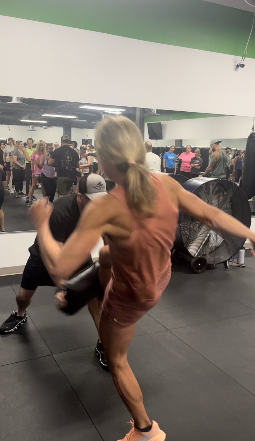 Woman makes a choke hold in self-defense training Stock Photo