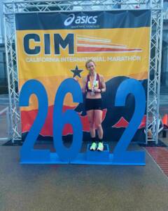 Whitney with medal at CIM Marathon