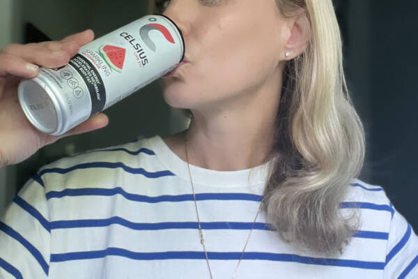 Whitney Heins drinking Celsius drink