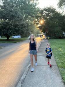 Whitney Heins walking her son to school.