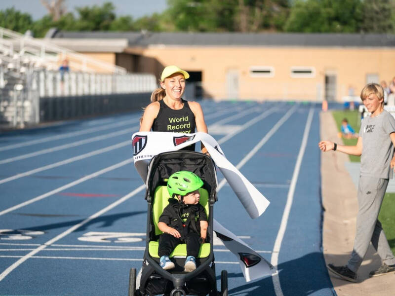 Neely Gracey sets the world record for the stroller mile in a time of 5:24. Breaking tape at track.