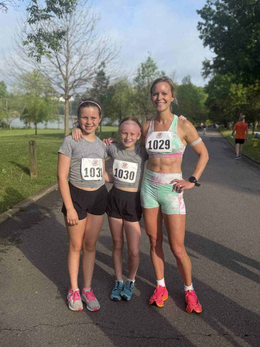 Whitney with her daughter and friend at a 5k